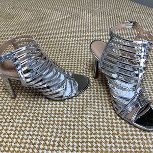 Christian Siriano Strappy heels, buckle high heels color silver. Size 8.5.